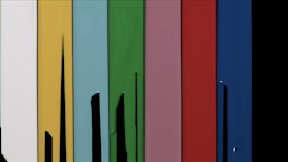 Eight vertical fields of paint sit next to each other. Each vertical field is the same size, but differently coloured. Some are incomplete. Placed alongside each other, the columns of paint resemble SMPTE colour bars, a standard measure for setting a television monitor to reproduce correct chrominance and luminance information.