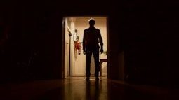 A mans ominous silhouette in a doorway