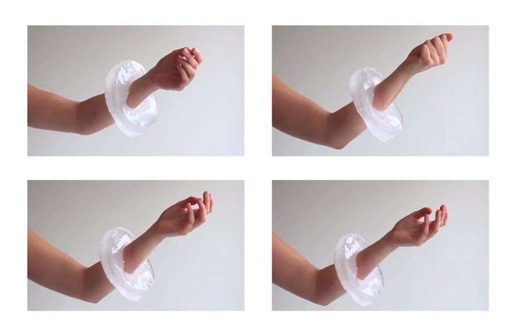Four stills showing an extended arm posing awkwardly whilst wearing a melting ice bracelet