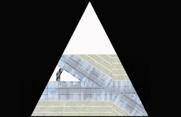 A triangle with geometric imagery inside.