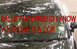 A car parked beneath a tree with dappled light reflections. Large text on screen reads, Ballet boyfriend I know your dad is a cop.