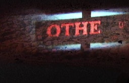 An LED sign and a view of a landscape are laid over one another.