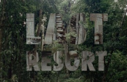 A dense forest has the words Last Resort superimposed, the words of images of buildings.