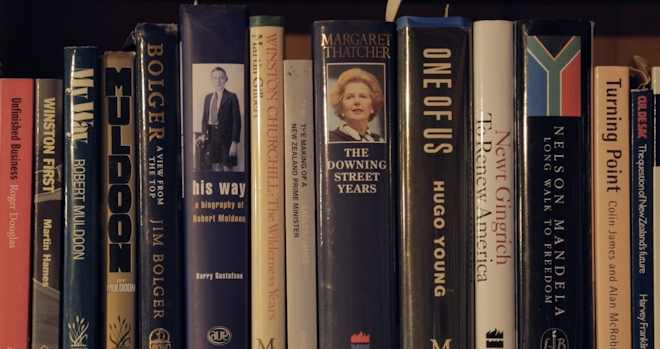 A close up of a bookshelf with memoirs by political figures such as Robert Muldoon, Margaret Thatcher and Newt Gringrich
