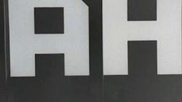 Large white letters A and H.