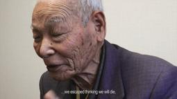 An elderly man has his eyes closed while talking, at the bottom is the text we escaped thinking we will die.