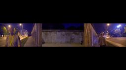 Three screen footage of a man walking along a footpath beside a large concrete wall with an empty road beside him.
