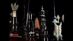 A variety of glossy ceramics sit on a table.
