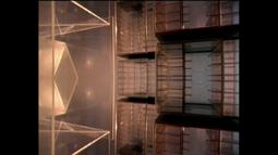 A variety of stacked plastic boxes appear like a futuristic city in hazy light.