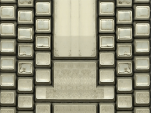 A computer manipulated birds eye view of a well used grimey keyboard which has no lettering on the key