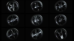 Nine car wheels spin positioned in a grid formation.