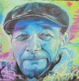 A spraypainted mural of Martin Rumsby