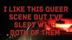 People sit in a parked car with red light illuminating the interior. On screen there is text reading, I like this queer scene but I've slept with both of them.