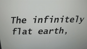 A computer screen with text reading, The infinitely flat earth