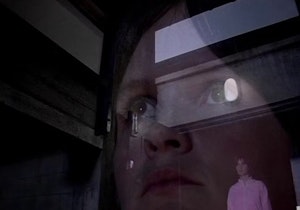 An close up image of Sarah Jane serious stern face looking up is overlaid with a picture of her taken from further back, showing her in a pink jumpsuit in a gym