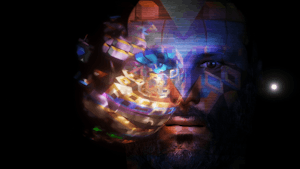 A computer-generated man looks forward with a glowing ball containing multiple things in front of him