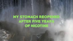 A waterfall crashes onto rocks. Neon green text reading "My stomach reopened after fives years of nicotine" is overlayed.