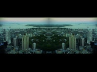 A view of a city taken from high up has been mirrored to reflect itself