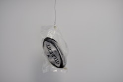 Vacuum-sealed rugby ball coated with semen
