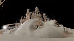 A digitally rendered face appears like a mountain below a large castle-like structure.