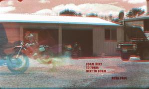 A 3d image of a motorbike and a 4 wheel drive outside a shed