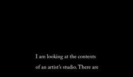 text reads: I am looking at the contents of an artist's studio. There are..
