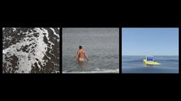 Three films side by side. The first of a shallow wave. The second of a person wading naked into the water. The third of a digital sea with a computer floating in the water.