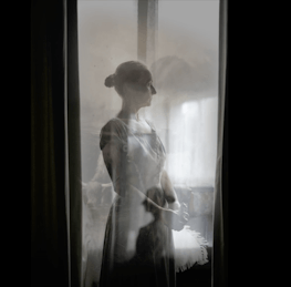 Kate Belton - Multiple black and white images of a colonial woman looking into the distance are overlaid onto one another.  The image provokes a serious, scary and eerie feeling