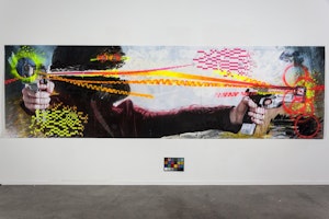 An installation view of a large scale painting in a gallery depicting to hands shooting guns
