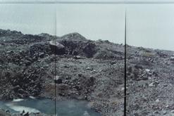 A rocky outcrop lakeside on Haupapa glacier