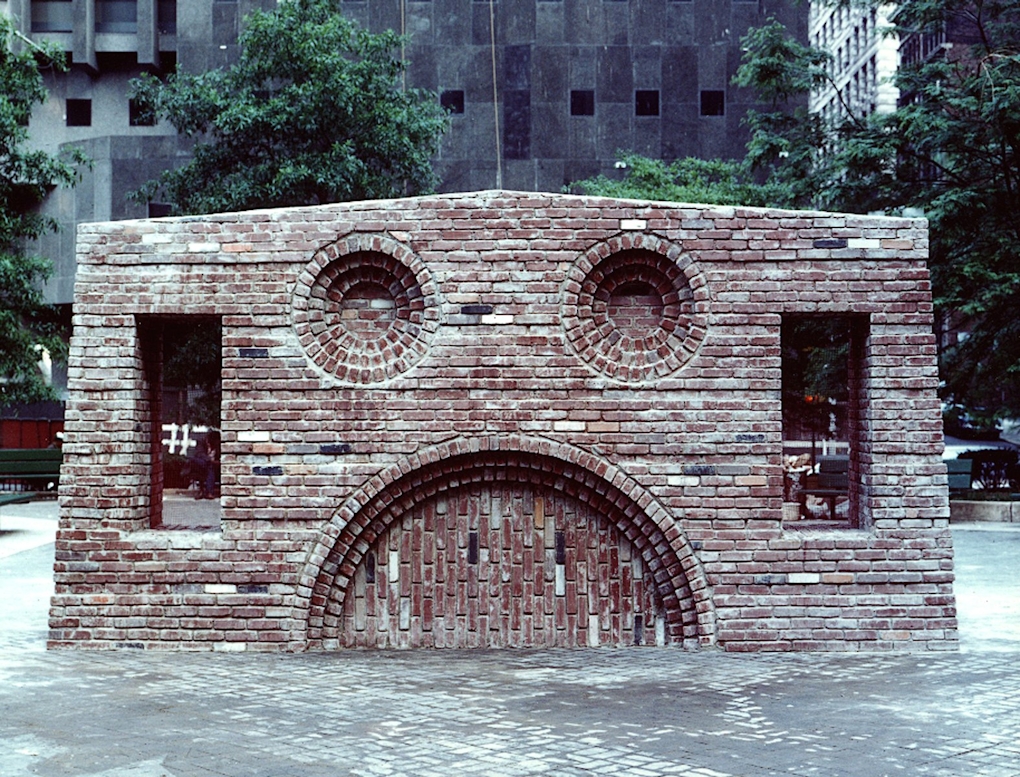 A public sculpture resembling a face made of bricks