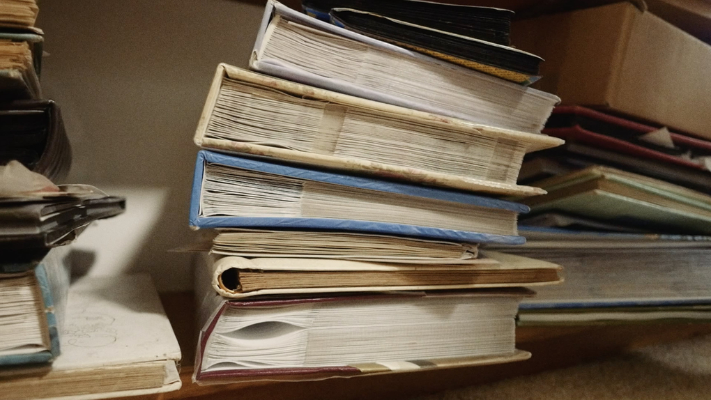 A stack of old books or photo albums