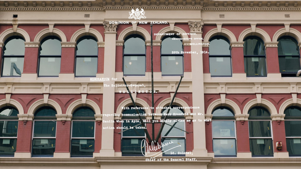 An imposing red brick facade is superimposed with text from a letter from the Department of Defence, dated 28 November 1914