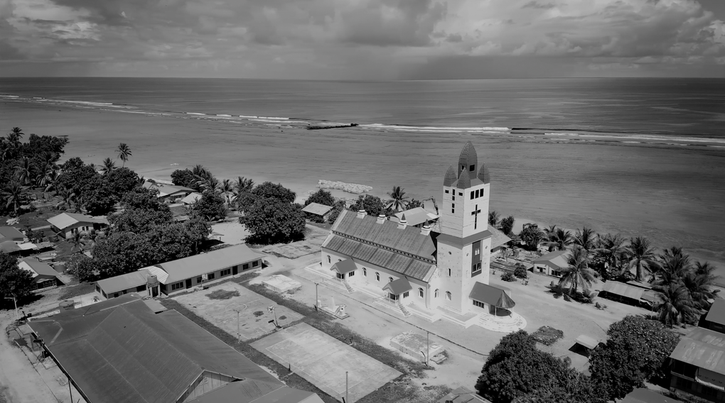 Black and white footage of a church on a Pacific island