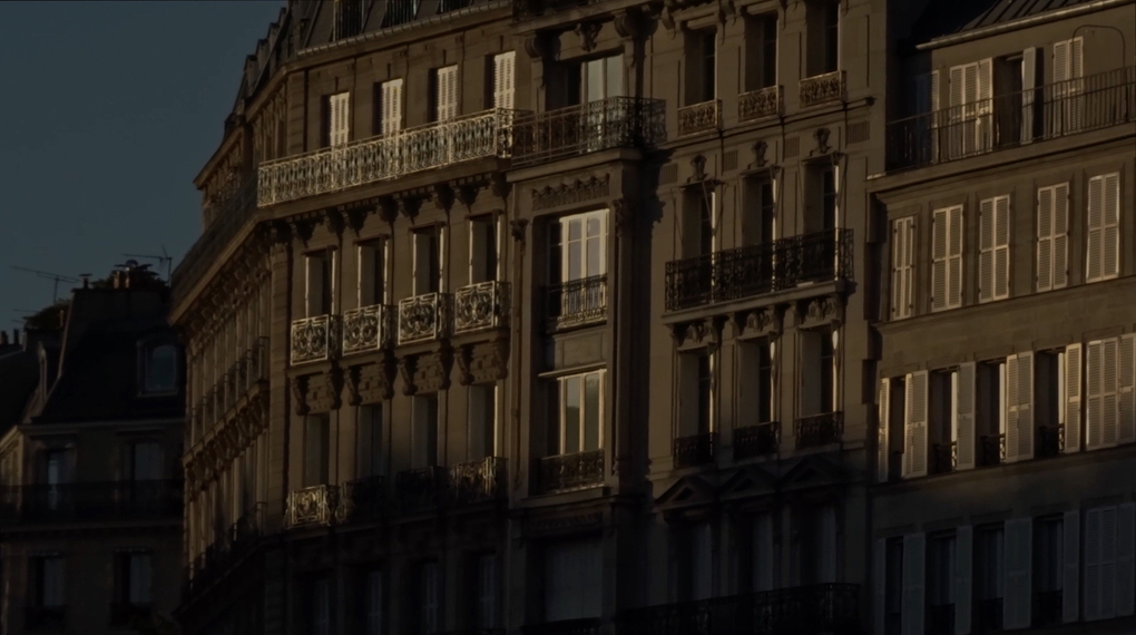 The facades of Parisian buildings in golden twilight