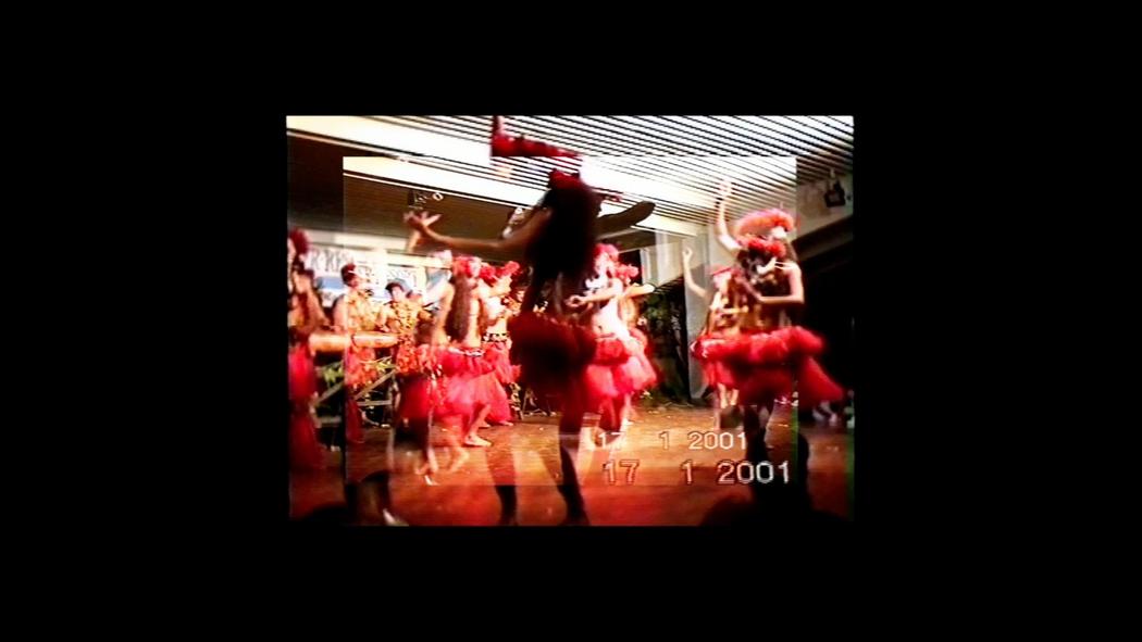 Several overlapping frames from video footage of Polynesian dancers dated 2001