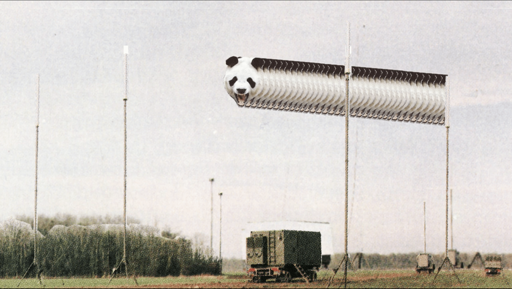 A magazine cutout of a field with a square green truck in the middle with a panda's head, repeated several times and appearing overhead