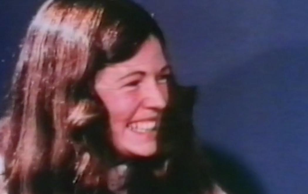 a 1970s woman smiles