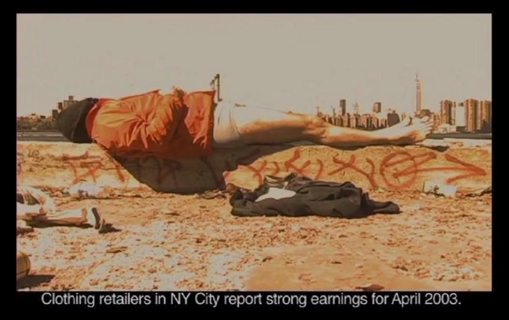 A person with no pants on is lying on a piece of concrete near a cityscape, the text below the image reads "Clothjing retailers in NY City report strong earnings for April 2003"