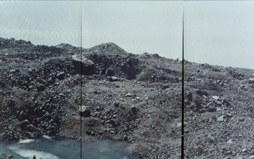 A rocky outcrop lakeside on Haupapa glacier