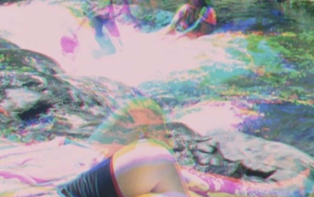 Multiple images of people playing in and laying next to a stream are overlaid in layers of cyan magenta yellow and black.