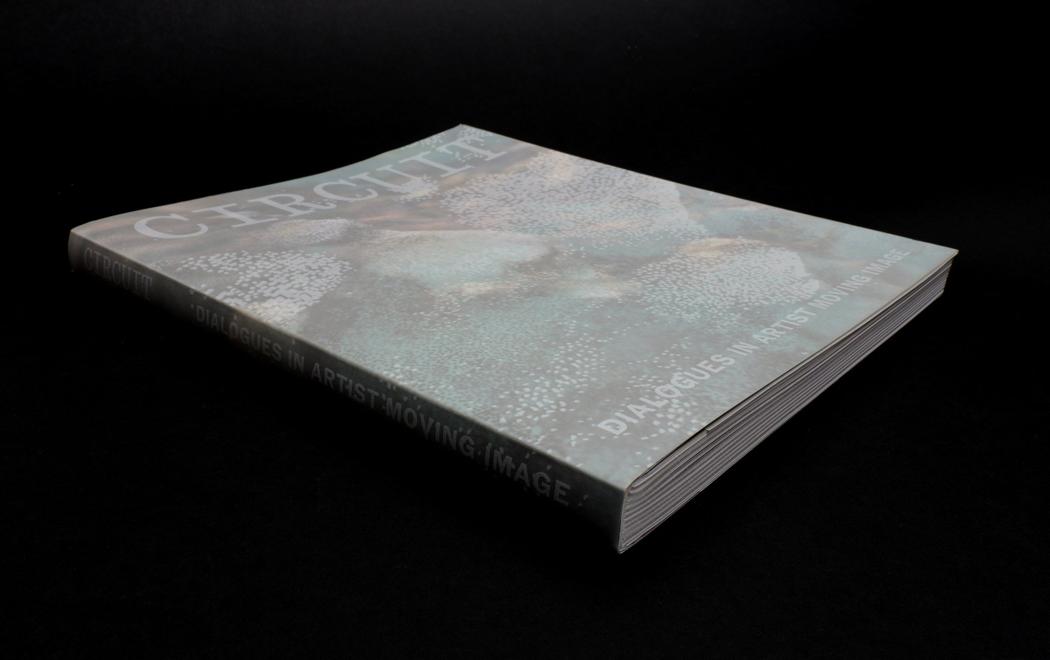 A book floating on a black background. The title says Detail: CIRCUIT: Dialogues in Artist Moving Image.