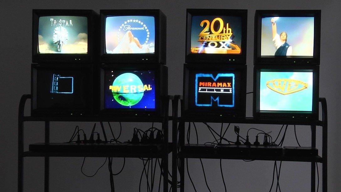 Eight box tvs play DIY versions of large production companies intros