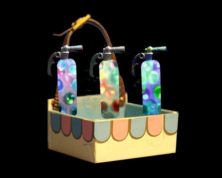 A mid-century concession stand box holds three gas cylinders which are full of colourful bubbles.