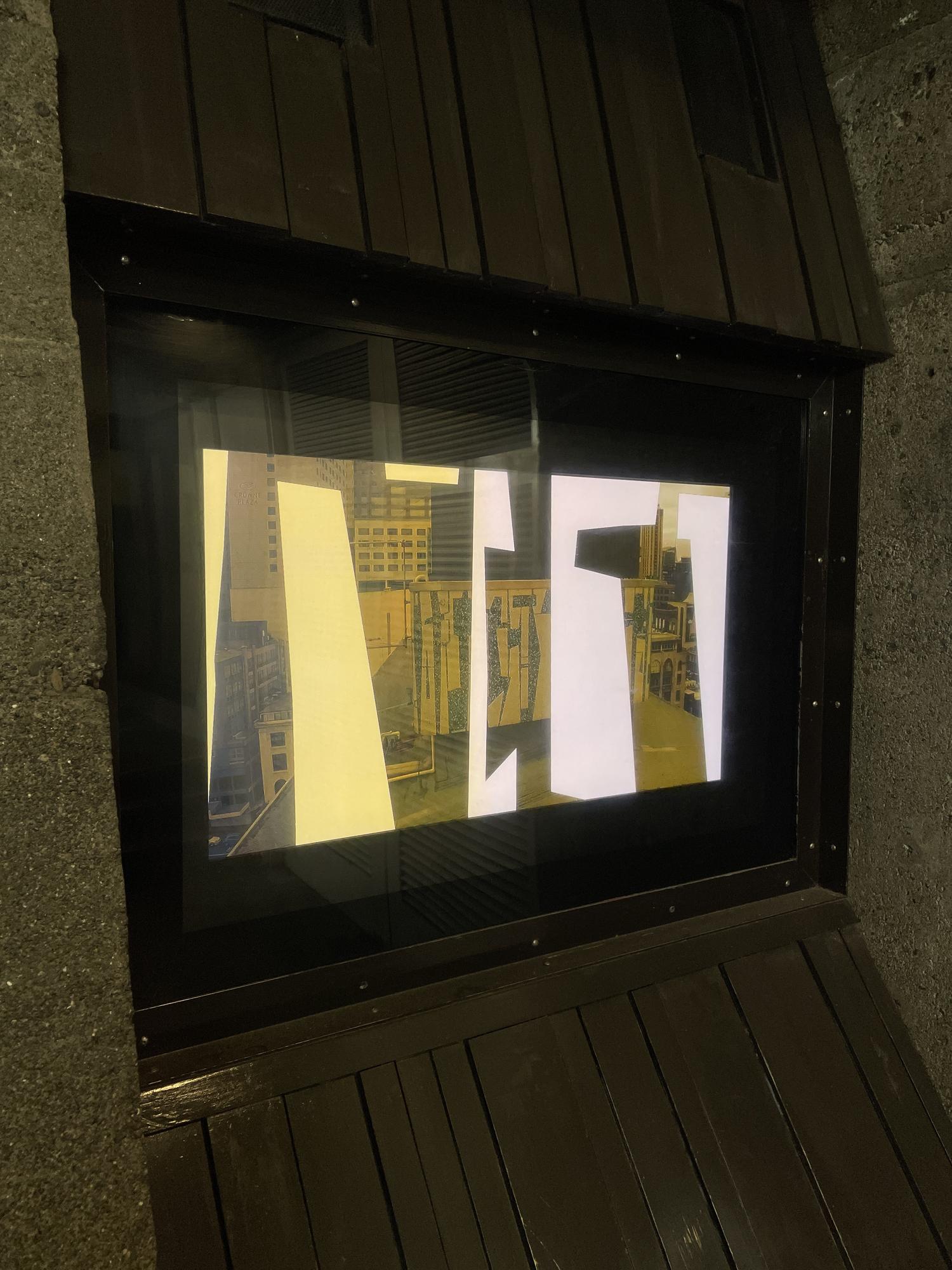 A close-up of an inset video screen sited in a pedestrian walkway