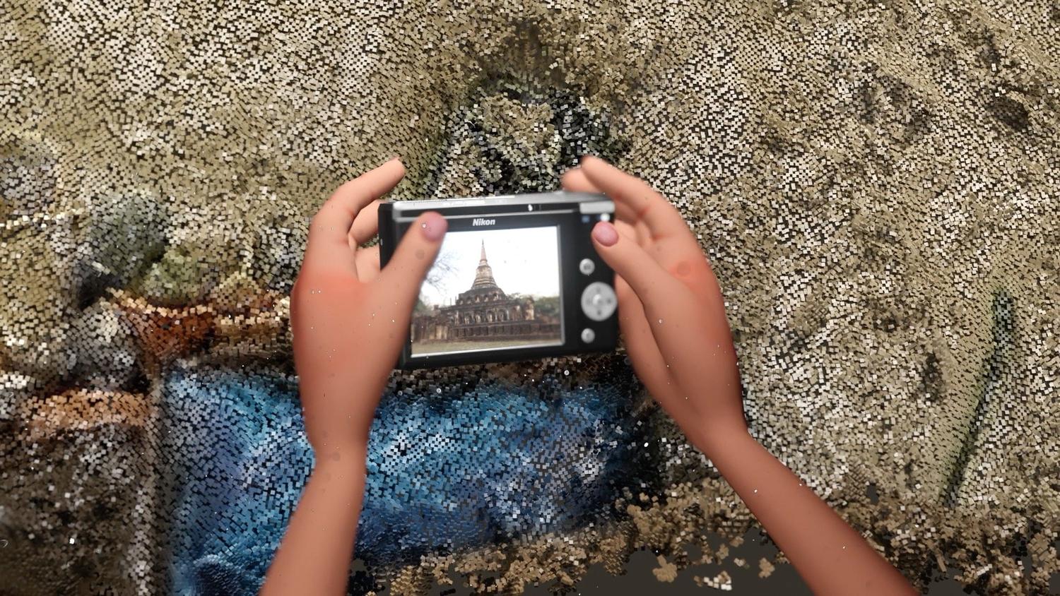 A pair of animated hands holds a camera in front of a pixellated background. On the viewfinder of the camera we see a Thai temple