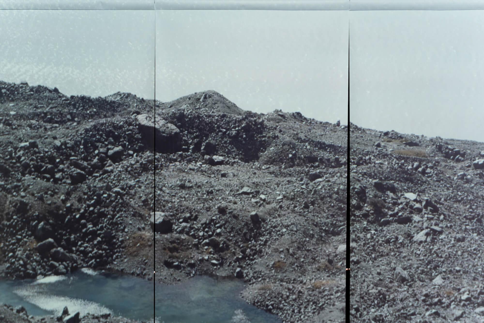 A rocky outcrop lakeside on Haupapa glacier