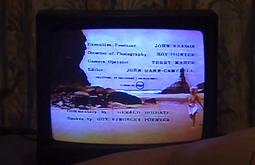 Credits roll on a CRT tv.