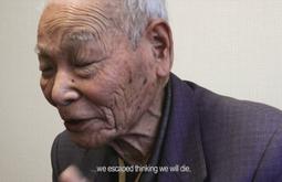 An elderly man has his eyes closed while talking, at the bottom is the text we escaped thinking we will die.