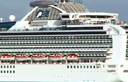 A large cruise ship floats past.